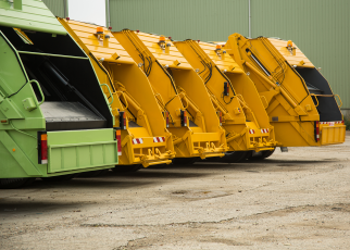 Yellow and green recycling trucks using Cypress VUE